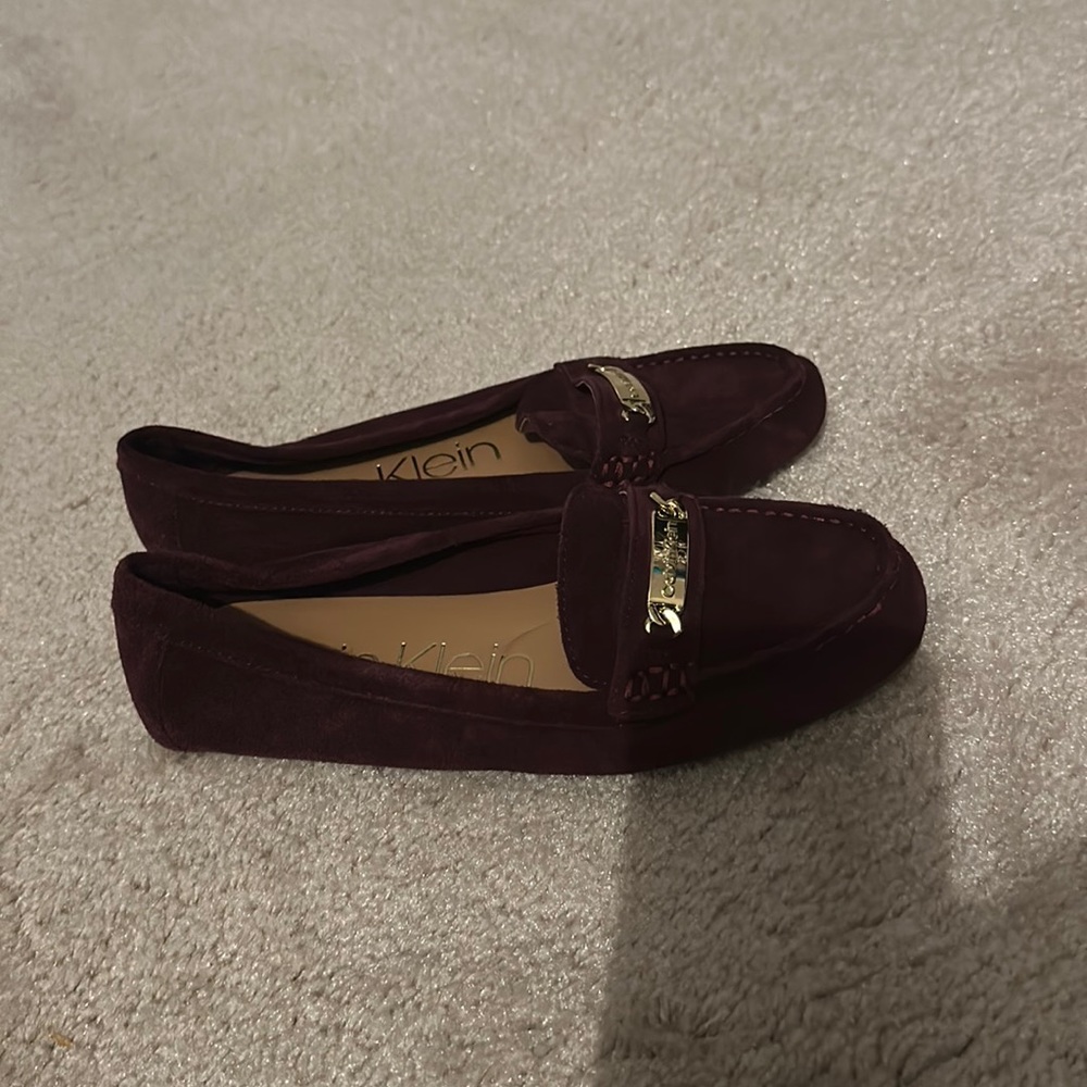 Brand New Calvin Klein loafers color is dark cranberry